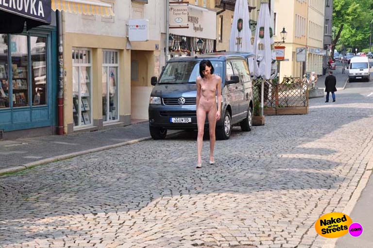 Skinny bitch walks the streets naked