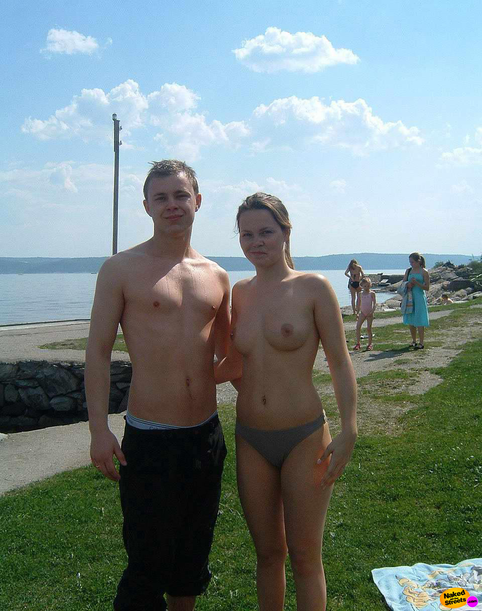 Sexy topless teen girl posing topless at the beach