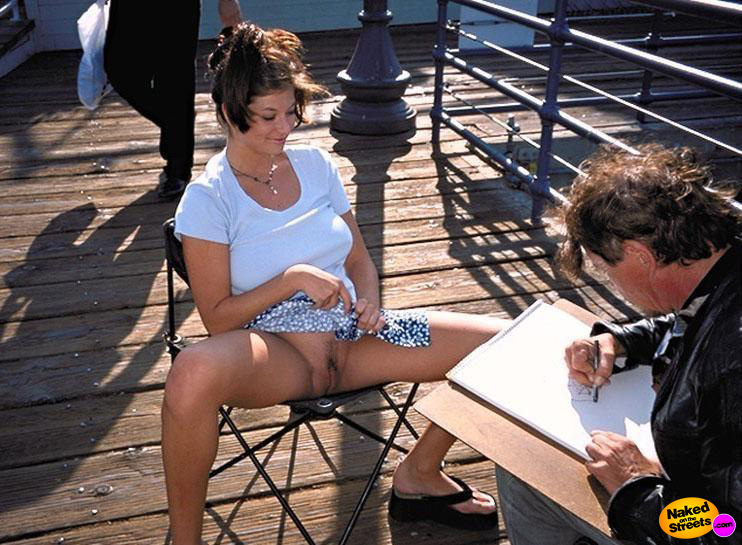 Naughty chick getting a drawing of her pussy at the pier