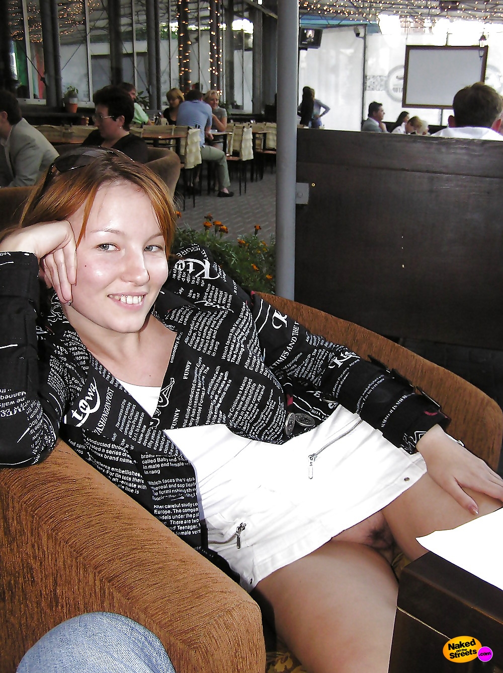 Cheeky girlfriend flashing pussy in restaurant photo