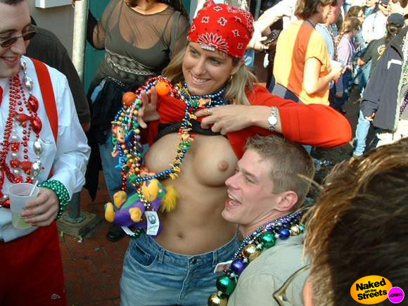 Sweet amateur girl shows off her nice tits at Mardi Gras