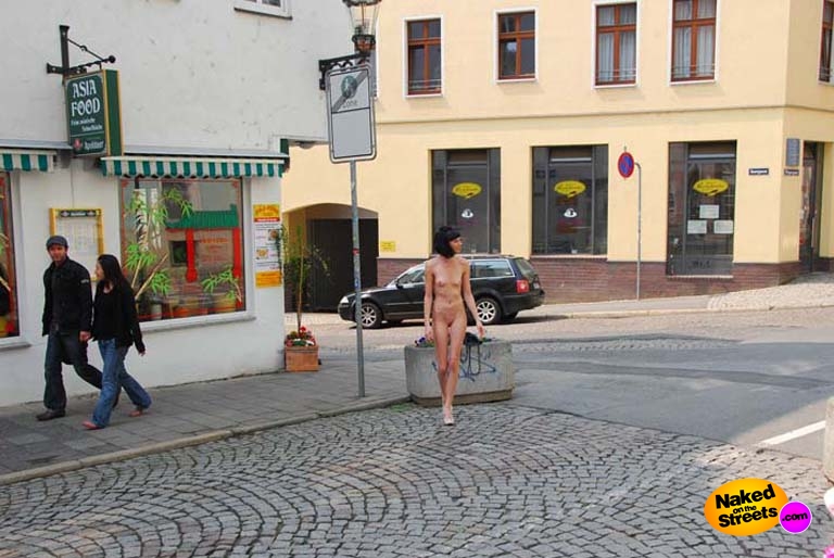 Skinny bitch walks the streets naked