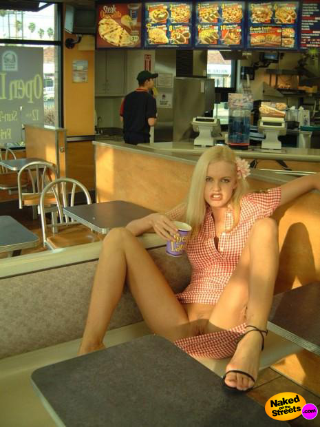 Crazy blonde whore flashing her snatch in a fast food restaurant