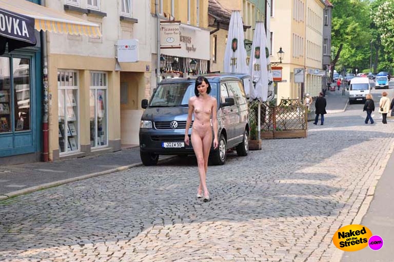 Skinny bitch walks the streets naked