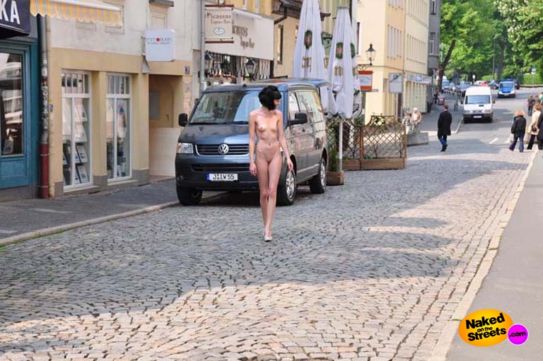 Skinny bitch walks the streets naked