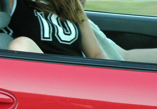 Horny amateur bitch in a car flashing tits and ass