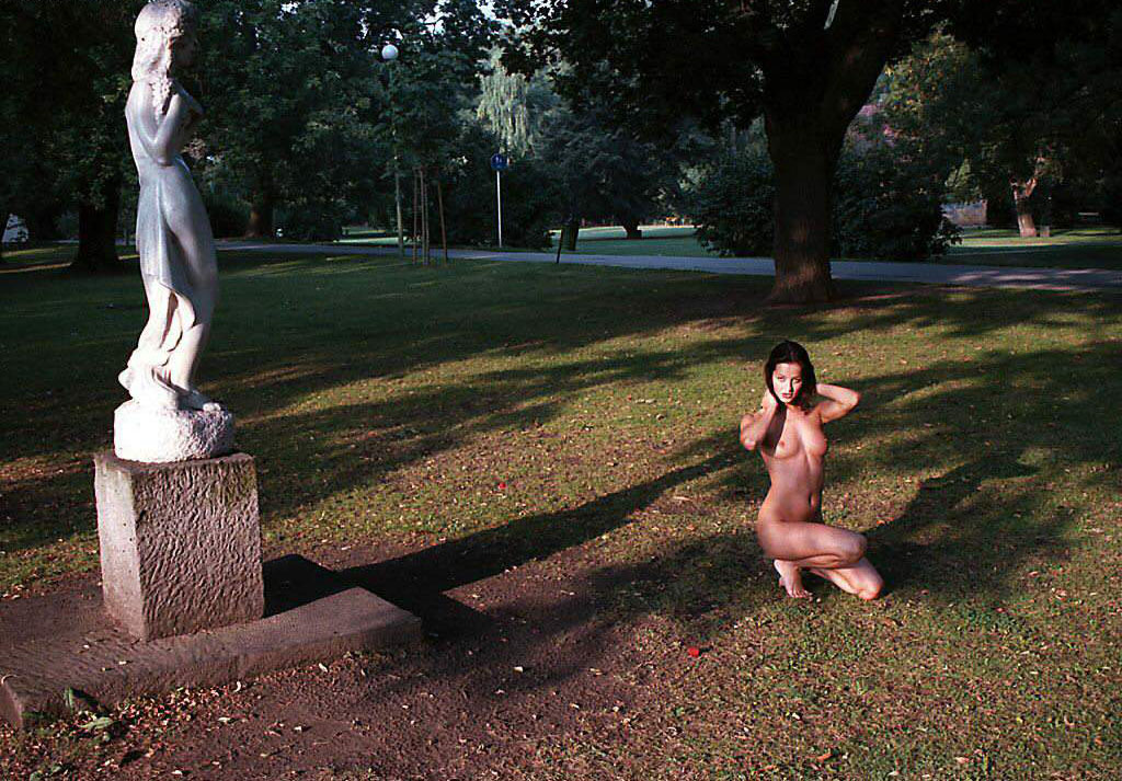Very slutty toned girl shows off her body in the park
