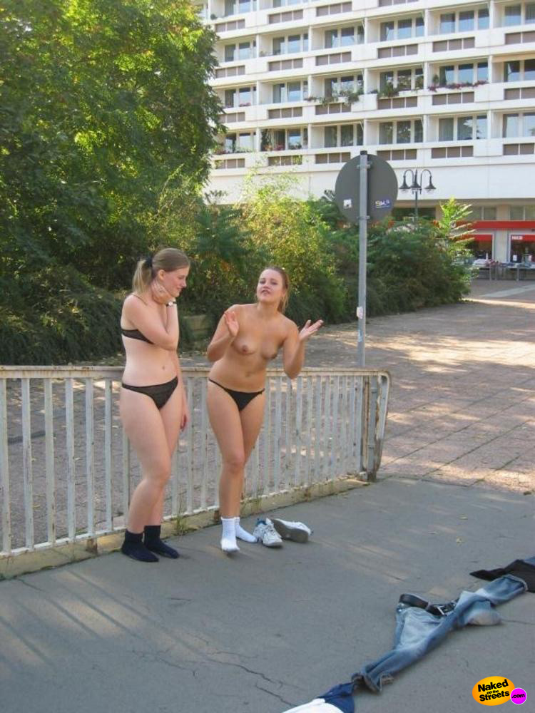 Two teen girls strip and pose in public