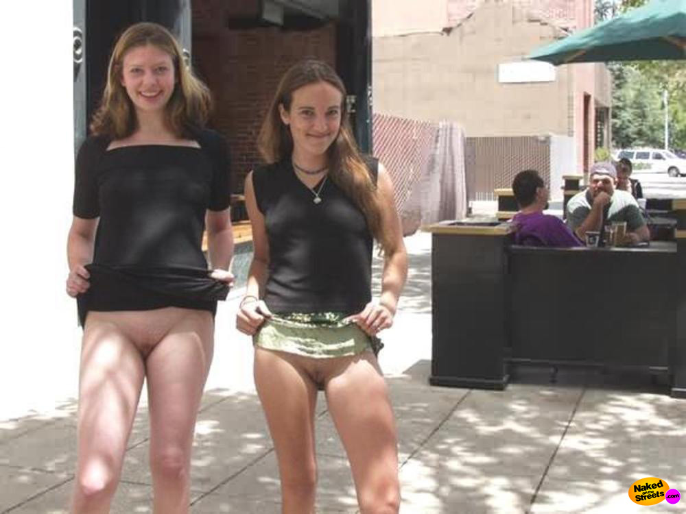 Two teen girls show their pussies on the street