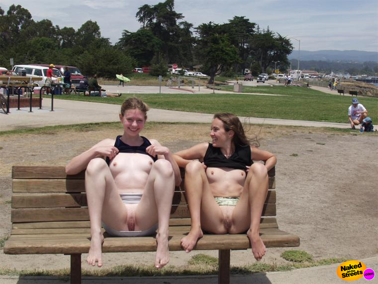 Two teen bitches flashing their pussies and titties on a park bench