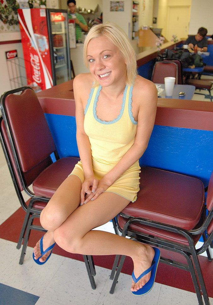 Hot blonde college girl flashing her pussy in a bar