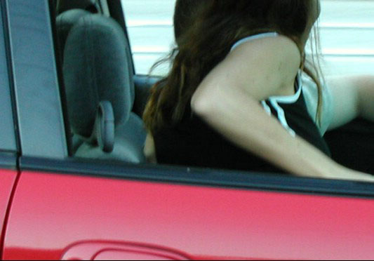 Horny amateur bitch in a car flashing tits and ass