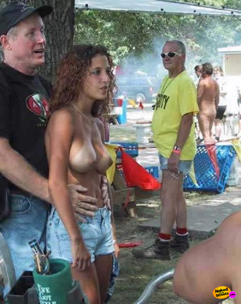 Proud dad shows off his daughters big tits in the park