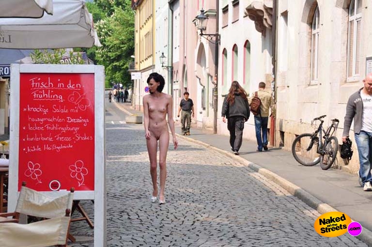 Skinny bitch walks the streets naked