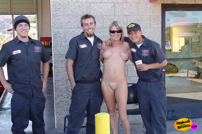 Sexy milf gets her picture taken with 3 horny garage workers