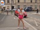 Redhead teen chick flashes her goodies on the street