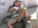 Two hot teens share a dildo in public