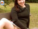 Shy teen girl flashes her pussy on a park bench in public