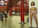 Chick in a trainstation baring all! The other girls in the pic look interested.. (Pictures)