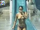Teen chick exposes titties in a water slide