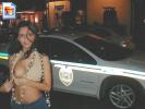 Pakistani whore shows her tits in front of cop car