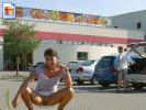 Sexy slut shows off her snatch on the parking lot