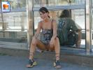 Naughty girl shows her snatch in the street