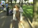 Hot blonde chick flashing her tits and pussy in the park under a long overcoat