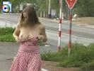 Girl in a striped dress flashing her titties on the sidewalk