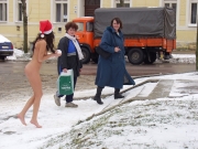 Naughty brunette has fun walking naked in the streets (Galleries)