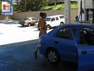 Sexy girl gets some gas for her car naked (Galleries)