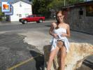 Nerdy redhead poses nude all over town (Galleries)