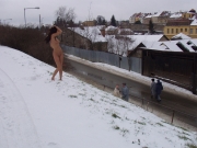 Naughty brunette has fun walking naked in the streets (Galleries)