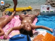 Topless girl soaking up the sun