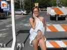 Nerdy redhead poses nude all over town (Galleries)