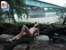 Sexy girl posing naked at the base of a big bridge (Galleries)