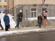 Naughty brunette has fun walking naked in the streets (Galleries)